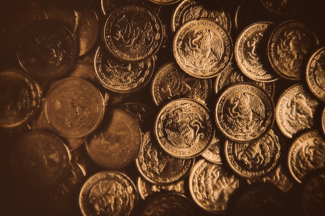 zlaté mince s orlicí
